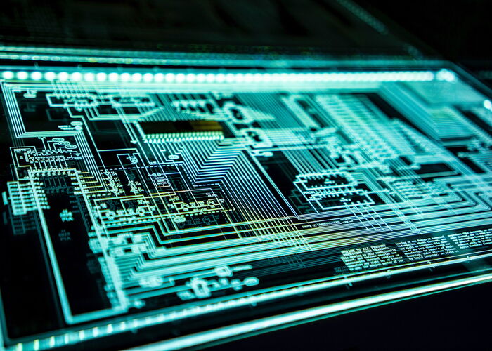 Photo : Une plaque lumineuse reprenant un système technique complexe